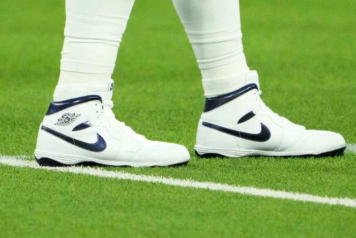View of Dallas Cowboys quarterback Dak Prescott's white and blue Air Jordan cleats.